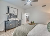 Thumbnail 9 of 53 - Bedroom with ceiling fan and hardwood flooring at The Barton Apartments, Texas, 75206