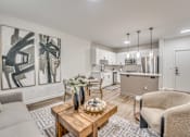 Thumbnail 1 of 53 - Open concept living area with modern kitchen at The Barton Apartments, Dallas, Texas