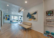 Thumbnail 15 of 37 - Spacious lobby with modern seating at Vue Live Oak Apartments, Dallas, TX