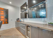 Thumbnail 22 of 37 - Contemporary kitchen with stainless steel appliances at Vue Live Oak Apartments, Dallas, 75204