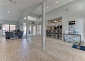 Thumbnail 30 of 39 - A spacious living room with a dining area and a kitchen in the background. at Wilson Crossing, Cedar Hill, TX