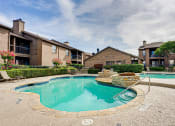 Thumbnail 17 of 29 - Extensive Resort Inspired Pool Deck at Woodland Hills, Irving, TX, 75062