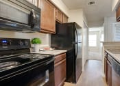 Thumbnail 6 of 29 - Fully Equipped Kitchen at Woodland Hills, Irving, 75062