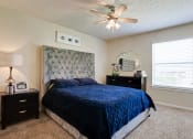 Thumbnail 12 of 29 - Bedroom With Ceiling Fan at Woodland Hills, Irving, TX, 75062