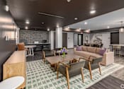 Thumbnail 14 of 19 - A modern living room with a green and white checkered floor.
