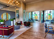 Thumbnail 2 of 17 - A large room with a long table and chairs.