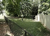 Thumbnail 21 of 22 - A white fence borders a green lawn.