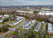 Thumbnail 1 of 23 - An aerial view of a residential area with houses and apartment buildings.