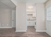 Thumbnail 3 of 23 - A kitchen area with a countertop and cabinets.
