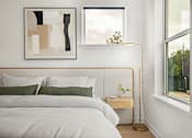 Thumbnail 15 of 46 - A bedroom with a white bed and a painting on the wall.
