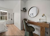 Thumbnail 11 of 46 - A room with a desk and chair.