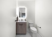 Thumbnail 24 of 46 - A white bathroom with a toilet, sink, and mirror.