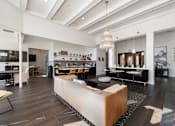 Thumbnail 6 of 38 - A modern living room with a large wooden coffee table in the center.