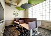 Thumbnail 7 of 41 - Professional conference space with sleek workstations and white accents