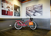Thumbnail 35 of 41 - red bike in front of a wall