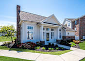 Thumbnail 3 of 37 - a large brick house with a garden in front of it