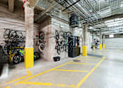 Thumbnail 24 of 32 - A bike rack with bicycles in a garage.