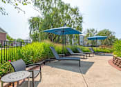 Thumbnail 15 of 47 - our patio has umbrellas and chairs and tables