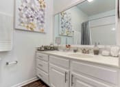 Thumbnail 38 of 47 - a bathroom with a sink and a mirror