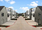 Thumbnail 37 of 46 - A row of modern houses with a red hose in the middle.