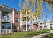 Thumbnail 42 of 47 - a row of apartments with balconies and a sidewalk