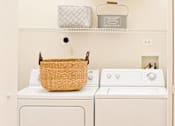 Thumbnail 34 of 41 - a laundry room with a washer and dryer