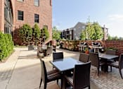 Thumbnail 15 of 41 - Inviting patio space with grilling and dining area