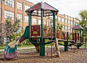 Thumbnail 16 of 41 - playground outside the Ovaltine Court apartment building