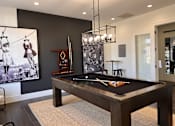 Thumbnail 7 of 47 - a billiards table in a game room with a painting on the wall
