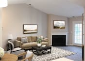 Thumbnail 12 of 21 - A living room with a fireplace and a painting on the wall.