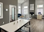 Thumbnail 6 of 37 - an open living room and dining room with a white table