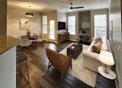 Thumbnail 28 of 41 - Open-concept living space with elegant furnishings and natural light