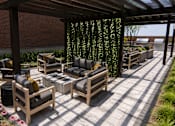 Thumbnail 29 of 32 - A wooden patio furniture set is placed on a tiled floor.