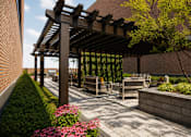 Thumbnail 28 of 32 - A wooden pergola over a patio with a bench and a planter.