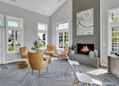 Thumbnail 4 of 37 - a living room with chairs and a fireplace