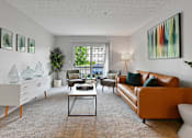 Thumbnail 20 of 37 - a living room with a leather couch and a table