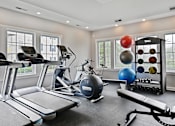 Thumbnail 9 of 37 - a gym with treadmills and other exercise equipment and windows