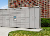 Thumbnail 28 of 37 - a small storage shed in front of a brick building