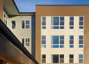 Thumbnail 5 of 43 - an exterior view of an apartment building with a sidewalk