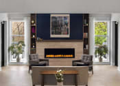 Thumbnail 9 of 43 - a living room with a fireplace and a table and chairs