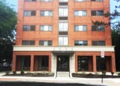 Thumbnail 10 of 15 - a red brick building on a sunny day