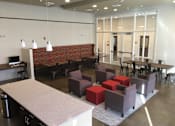 Thumbnail 2 of 13 - A room with a long table and chairs.