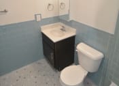 Thumbnail 14 of 15 - a bathroom with a toilet sink and bathtub