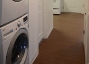 Thumbnail 11 of 15 - a washer and dryer in a laundry room