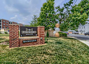Thumbnail 1 of 32 - A sign for Foundry Square is in front of a grassy area.
