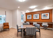 Thumbnail 16 of 54 - a conference room with a table and chairs and a window