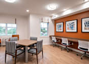 Thumbnail 12 of 54 - a conference room with a wooden table and chairs