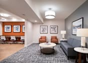 Thumbnail 7 of 54 - a living room with couches and chairs and a table