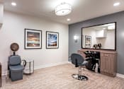 Thumbnail 8 of 54 - a salon room with two chairs and a mirror