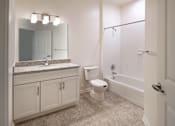 Thumbnail 26 of 54 - a bathroom with a shower toilet and sink and a mirror